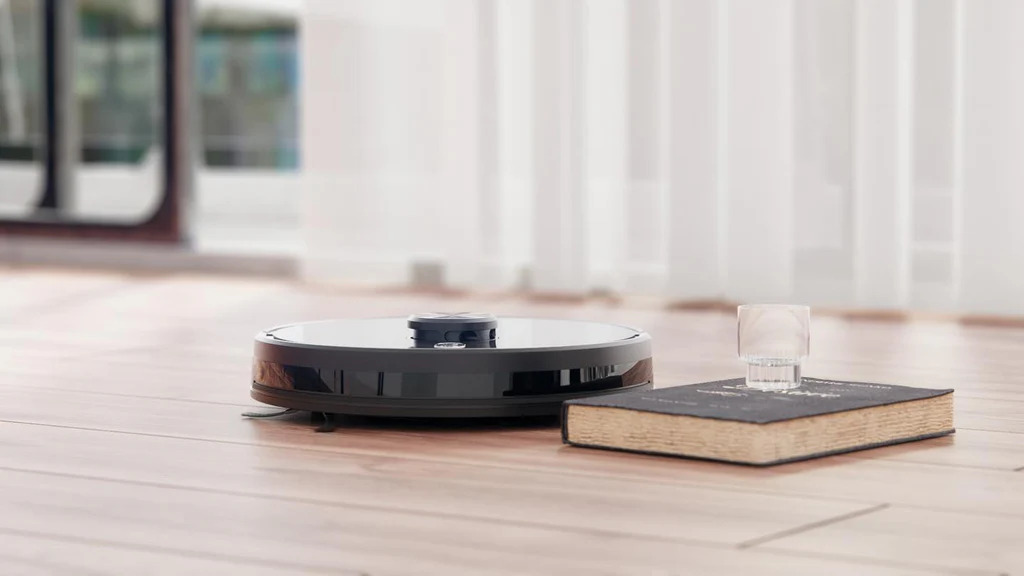 A robotic vacuum cleaner cleaning the house